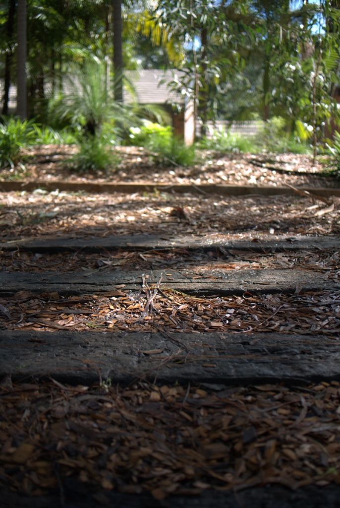 sleepers embedded into soil as pathway steps