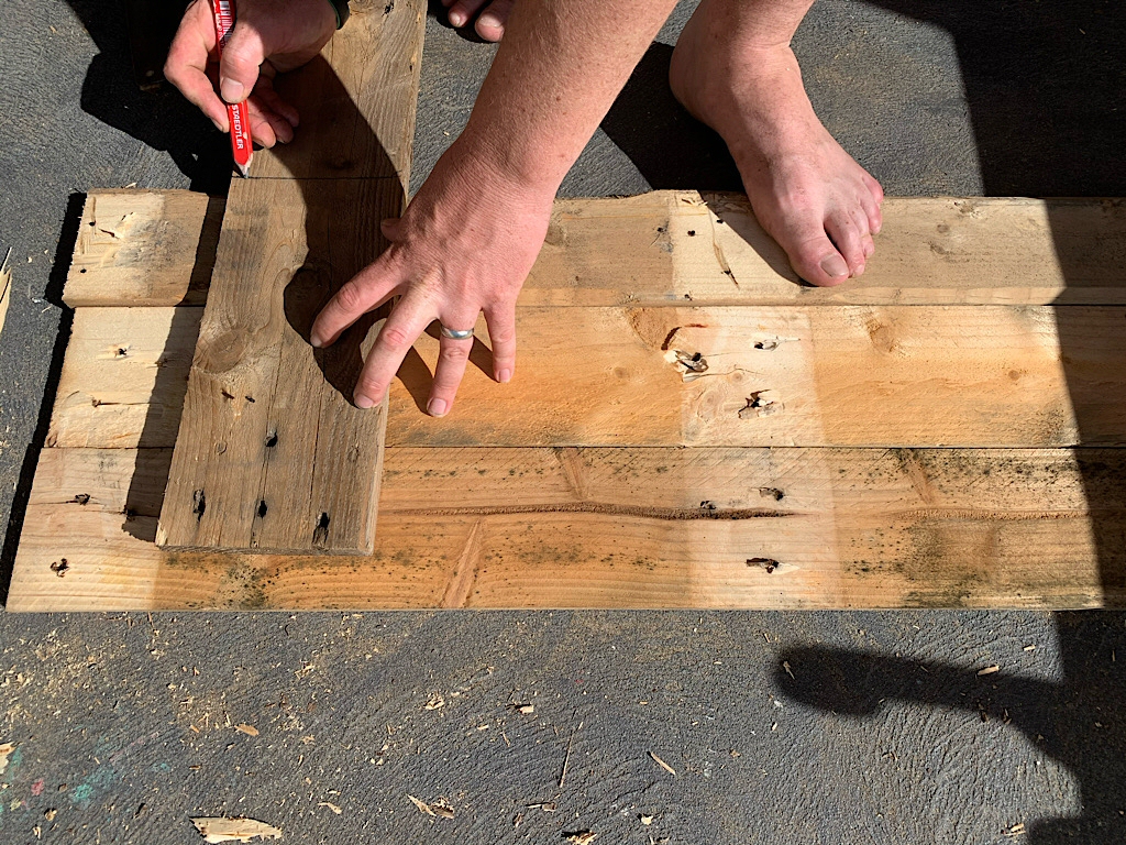 Marking pallet wood to make a raised bed